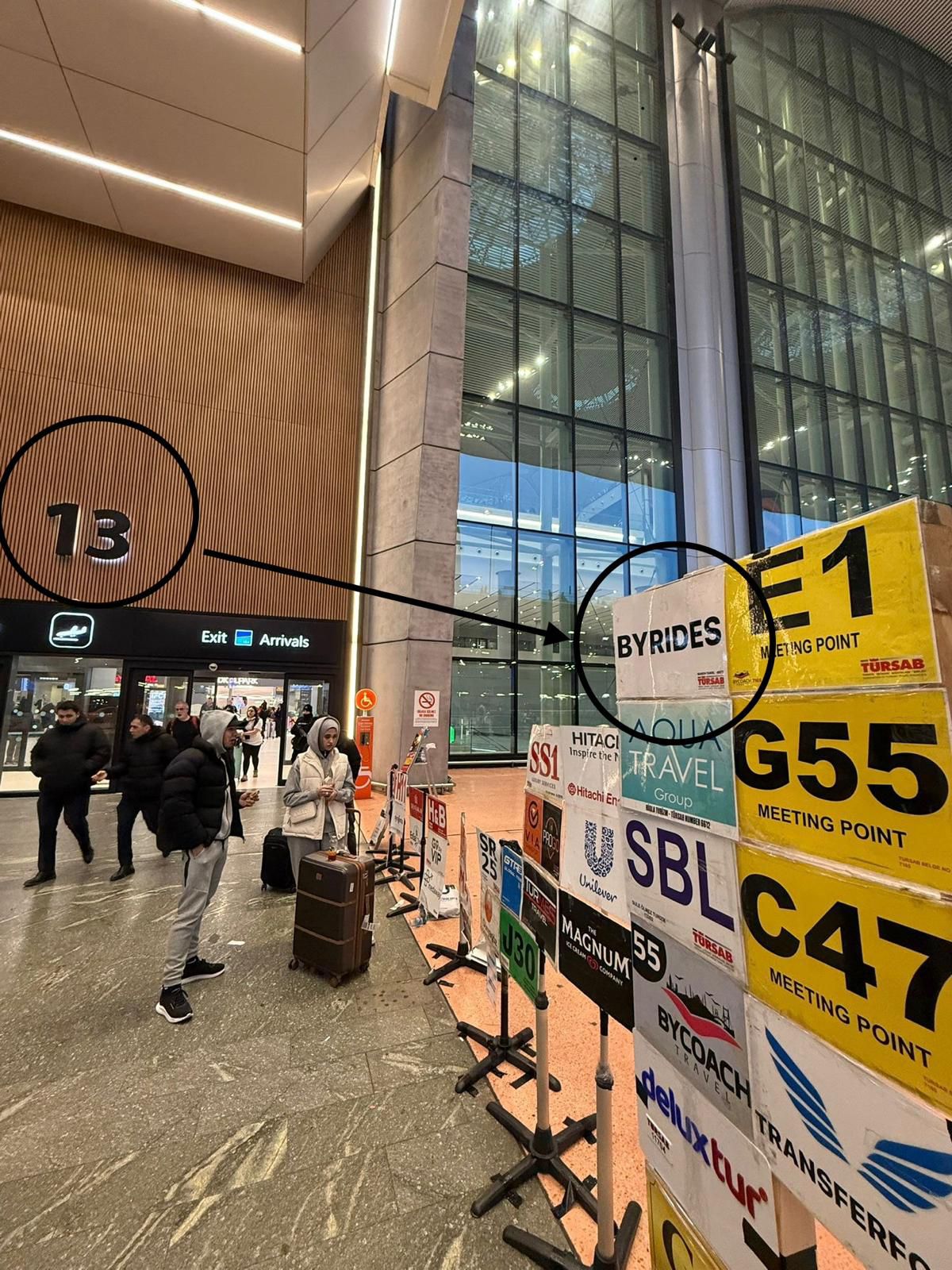 Exit Door 13 at Istanbul Airport with the BYRIDES sign